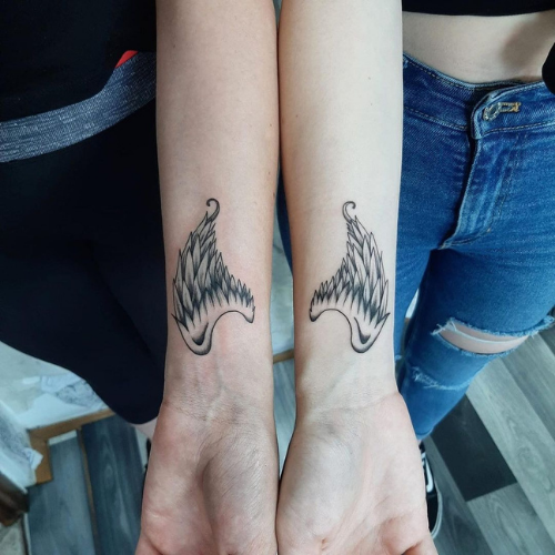 angel wings on forearms