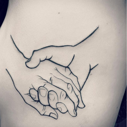 two hands holding each other tattoo