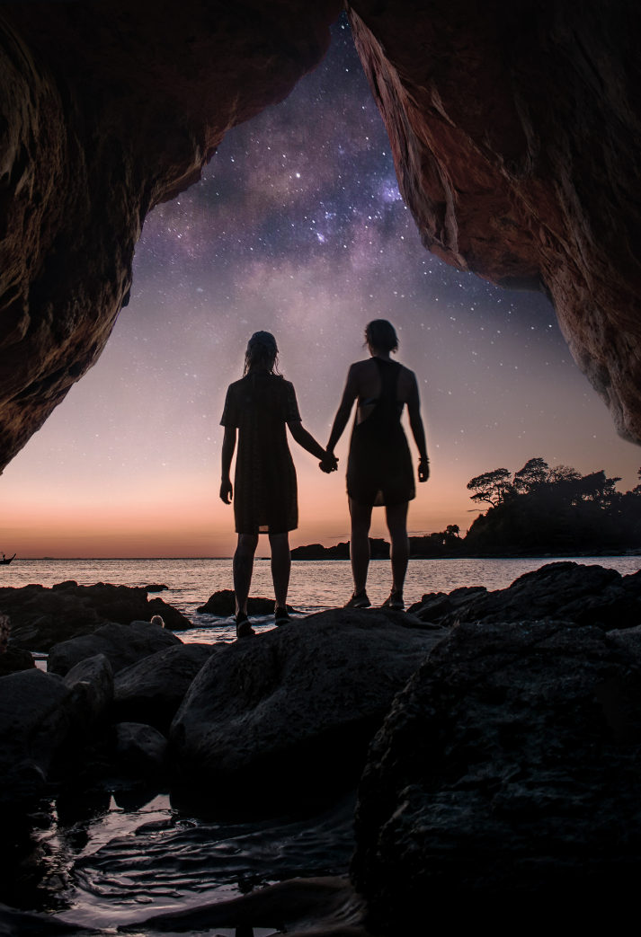 Image 2 couple holding hands coming out of a cave