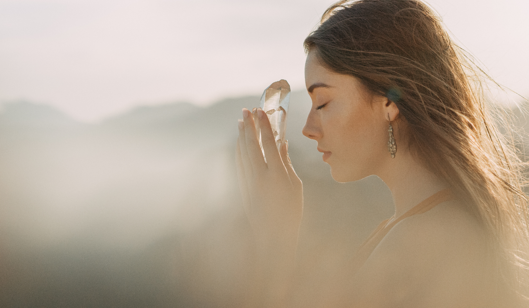 tf stages 6 woman holding a crystal