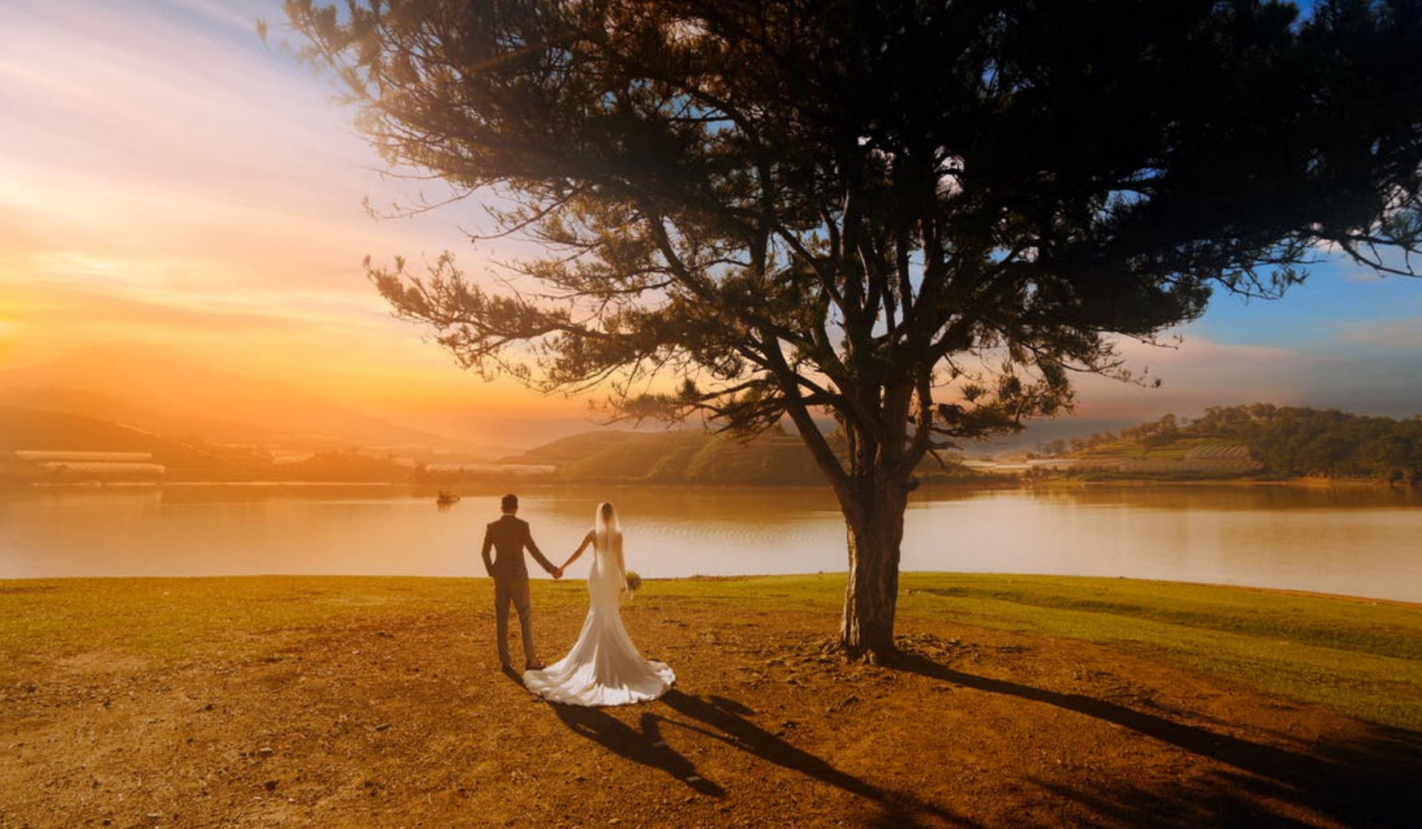 married couple looking at lake view