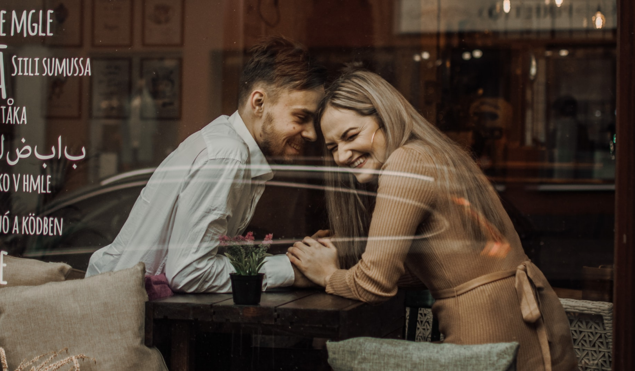 Man and woman laughing on a date