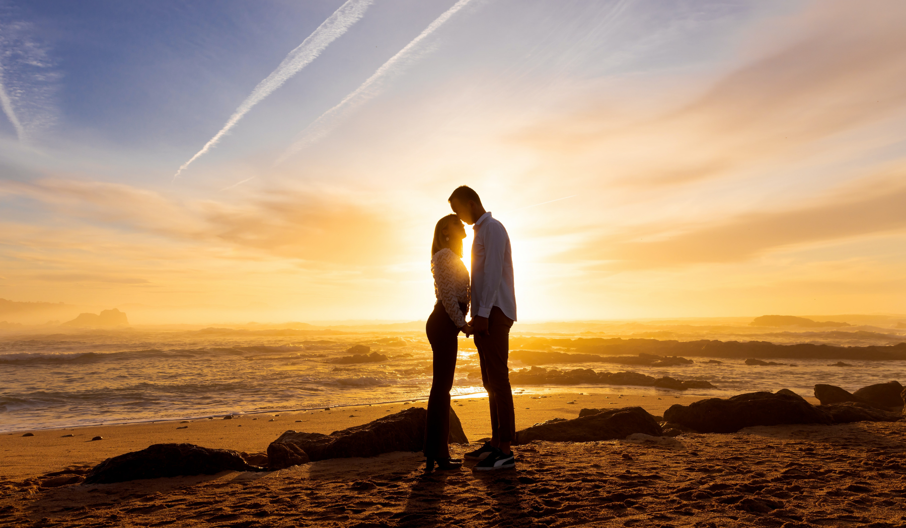 twin flames facing each other on the beach