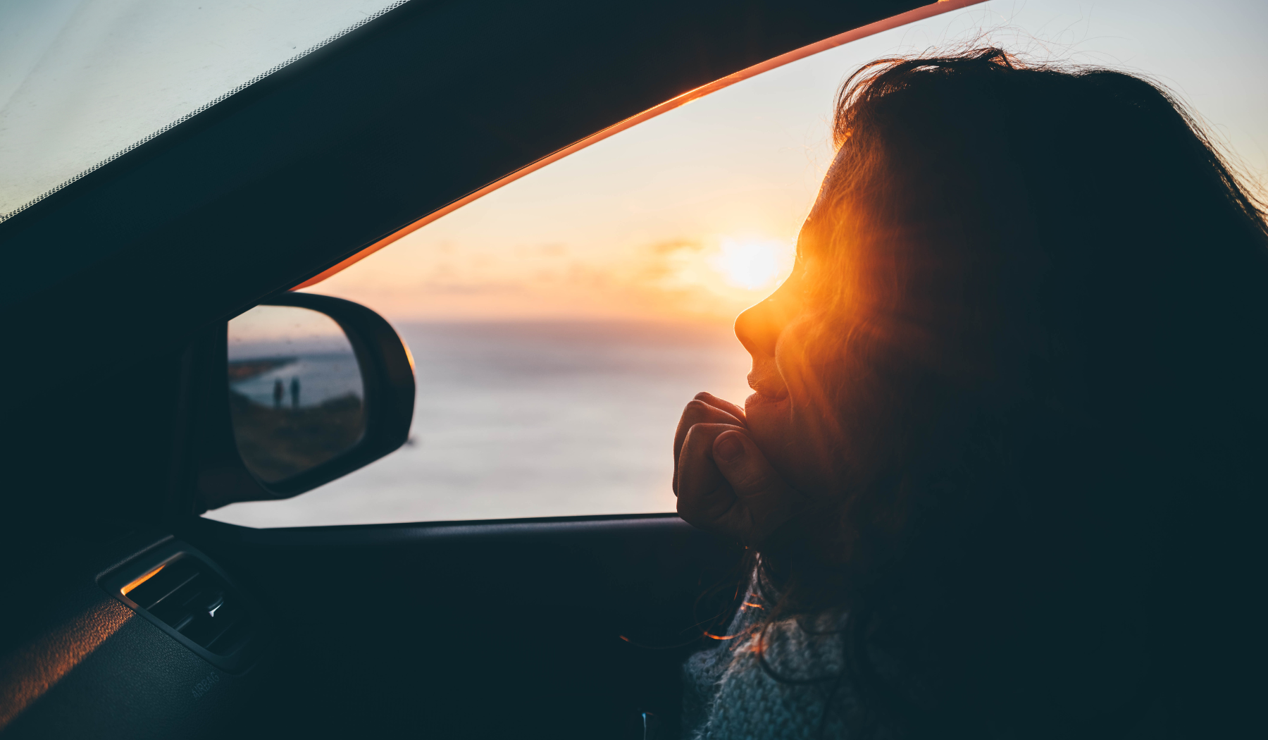 woman staring into the sunlight