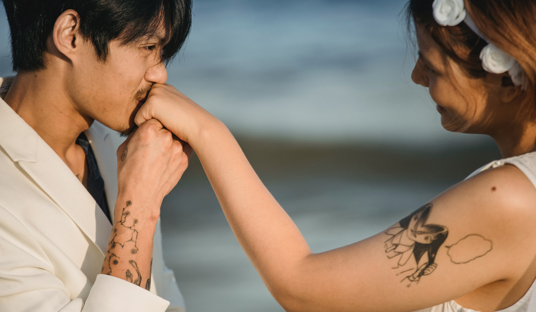 divine masculine kissing her hand